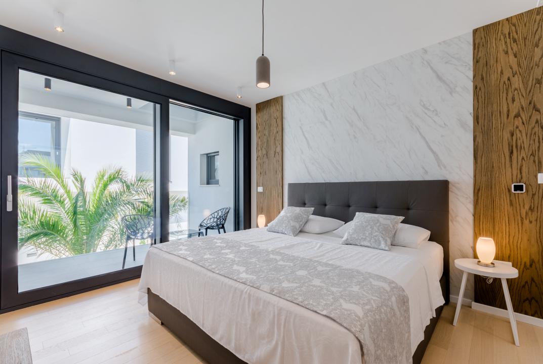 A modern bedroom with a big bed